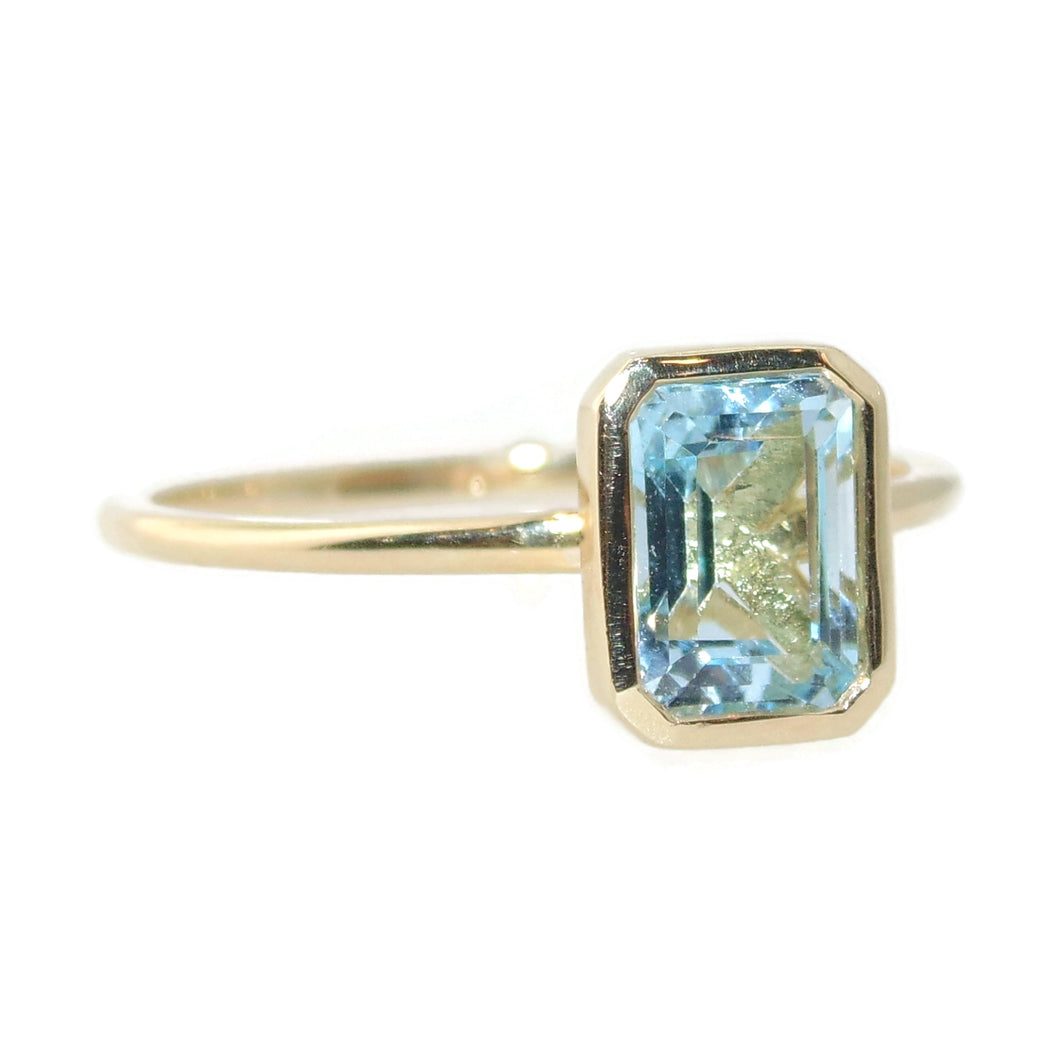 Emerald Cut Blue Topaz Ring in 14k Yellow Gold