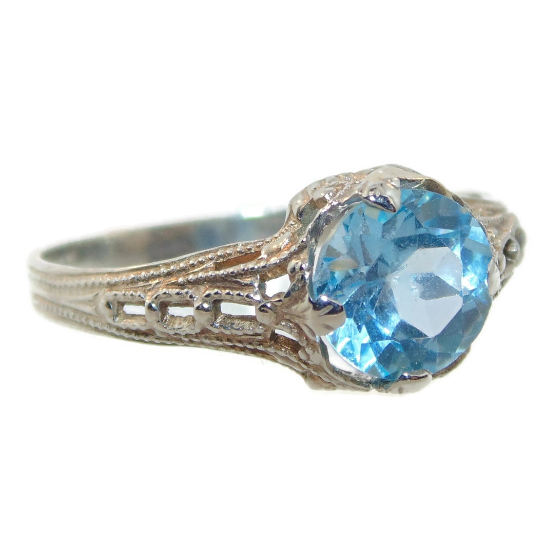 Round Cut Blue Topaz Ring in 10k White Gold