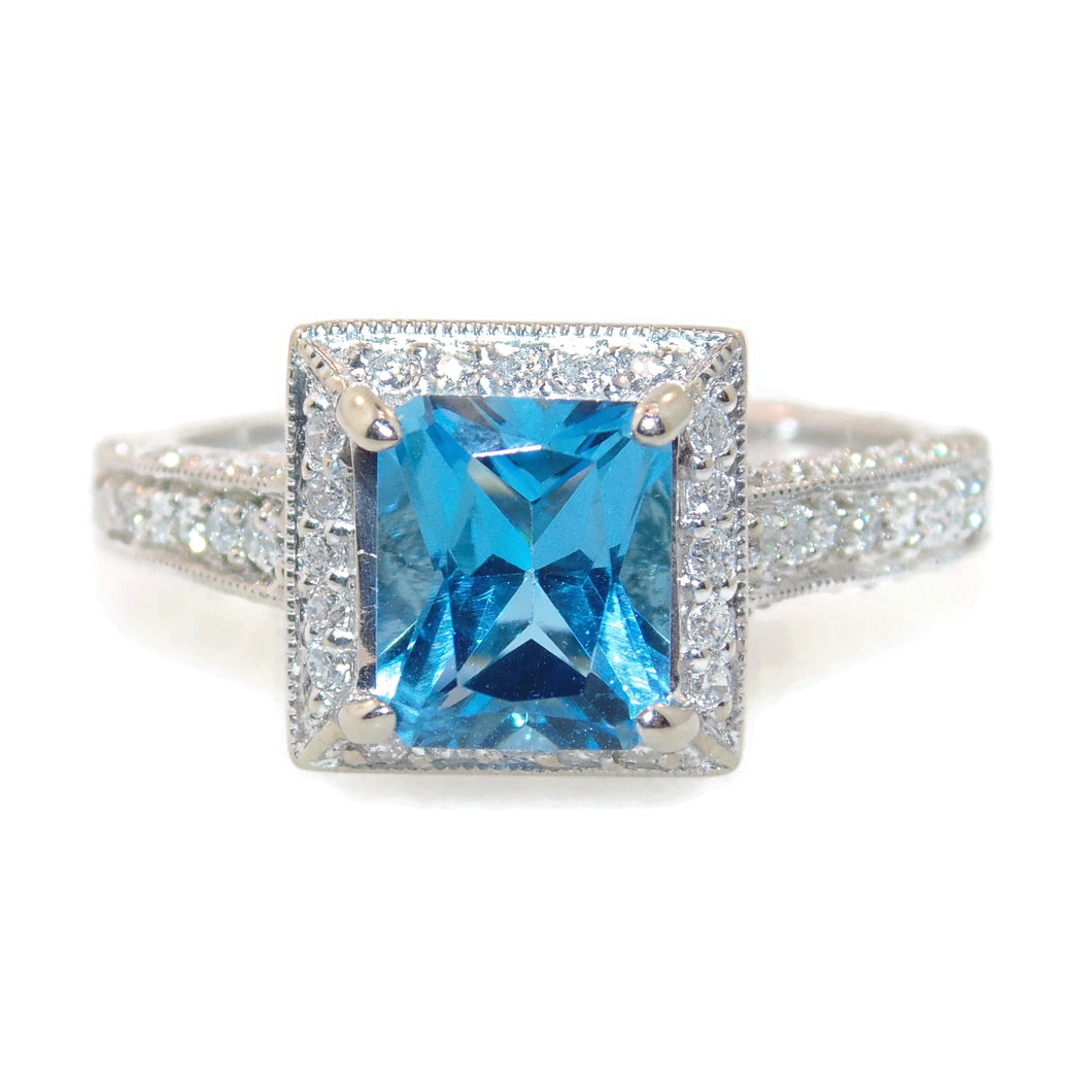 Emerald Cut Blue Topaz Ring in 14k White Gold Diamond Halo
