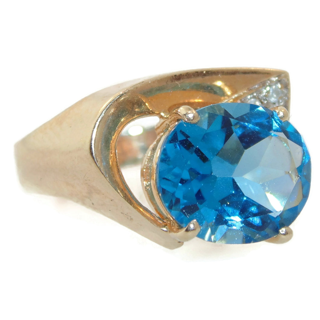 Oval Cut Blue Topaz Ring in 14k Yellow Gold Diamond Accent Free Form