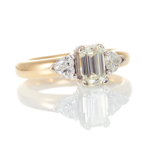 Classic Emerald Cut Diamond Ring with Accent Hearts in Yellow Gold